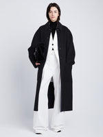 Front full length image of model wearing Reversible Double Face Coat in BLACK / STEEL GREY on BLACK side
