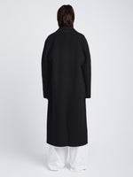 Back full length image of model wearing Reversible Double Face Coat in BLACK / STEEL GREY on BLACK side