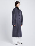 Side full length image of model wearing Reversible Double Face Coat in BLACK / STEEL GREY on STEEL GREY side