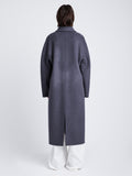 Back full length image of model wearing Reversible Double Face Coat in BLACK / STEEL GREY on STEEL GREY side