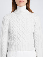 Detail image of model wearing Chunky Cable Bell Sleeve Sweater in OFF WHITE