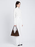 Image of model wearing Minetta Bag in CHOCOLATE