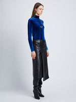 Side full length image of model wearing Ice Dyed Velvet Top in COBALT