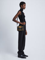 Image of model wearing Mixed Material PS1 Mini Crossbody Bag in WALNUT