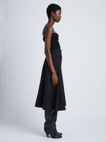 Side full length image of model wearing Wool Stretch Suiting Skirt in BLACK