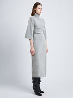 Side full length image of model wearing Viscose Wool Knit Dress in LIGHT GREY MELANGE