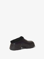 3/4 Back image of STOMP SHEARLING MULES in BLACK + SHEARLING