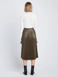 Back image of model wearing Faux Leather Pleated Skirt in wood