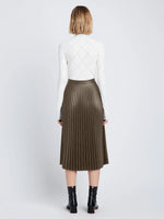 Back image of model wearing Faux Leather Pleated Skirt in wood