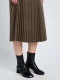 Detail image of model wearing Faux Leather Pleated Skirt in wood