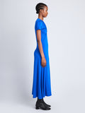 Side full length image of model wearing Slinky Jersey Keyhole Dress in BRIGHT BLUE