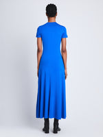 Back full length image of model wearing Slinky Jersey Keyhole Dress in BRIGHT BLUE