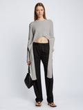 Front full length image of model wearing Ribbed Cotton Wrap Sweater in GREY MELANGE with straps hanging by sides