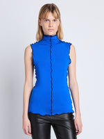 Front cropped image of model wearing Slinky Jersey Turtleneck Top in BRIGHT BLUE