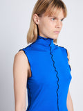 Detail image of model wearing Slinky Jersey Turtleneck Top in BRIGHT BLUE