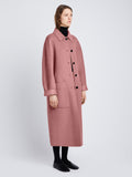 Side image of model in Melton Wool Coat in Dusty Pink Melange