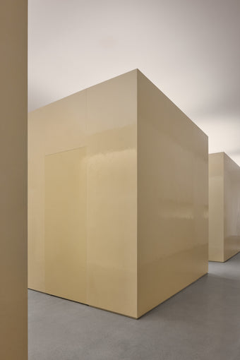 Interior image of new Proenza Schouler flagship store at 153 Mercer Street in New York. Image of large resin cubes in a concrete floored space.