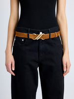 Cropped image of model wearing Monogram Belt in Suede in saddle