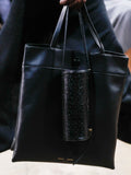 Image of model walking Proenza Schouler Fall Winter 2024 Runway wearing Split Tote in black