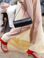 Image of model walking Proenza Schouler Fall Winter 2024 Runway wearing Silo Bag in black