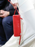 Image of model walking Proenza Schouler Fall Winter 2024 Runway wearing Silo Bag in rosewood