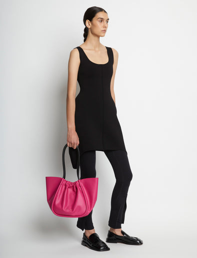 Image of model carrying Large Ruched Tote in FUSCHIA