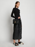 Image of model carrying Embossed Croc Dia Day Bag in BLACK across the shoulder