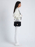 Proenza Schouler image of model wearing PS1 Tiny Bag In Soft Suede in black