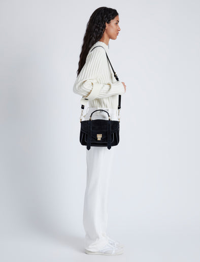 Proenza Schouler image of model wearing PS1 Tiny Bag In Soft Suede in black