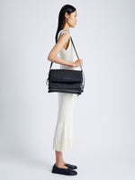 Image of model wearing City Messenger Bag in BLACK