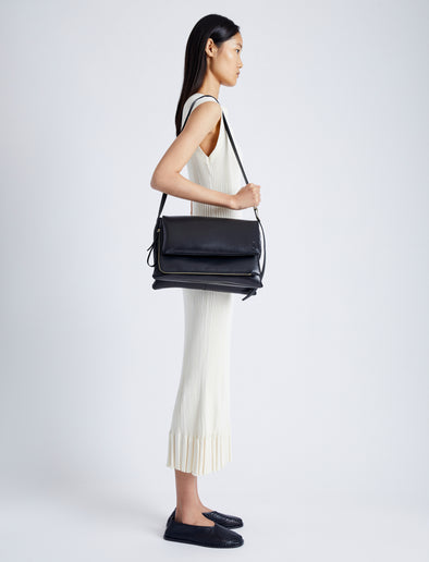 Image of model wearing City Messenger Bag in BLACK