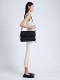 Image of model wearing City Messenger Bag in Puffy Nylon in BLACK