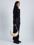 Image of model wearing Slide Bag in BEIGE