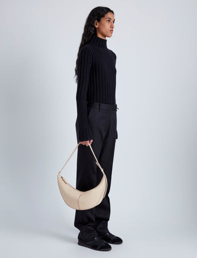 Image of model wearing Slide Bag in BEIGE