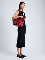 Image of model wearing Large Ruched Tote in Soft Shiny Calf in ROSEWOOD