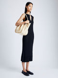 Image of model wearing Large Ruched Tote in Soft Shiny Calf in BIRCH