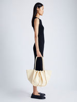 Image of model wearing Large Ruched Tote in Soft Shiny Calf in BIRCH