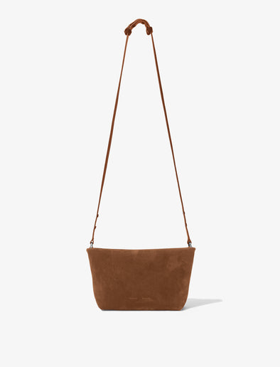 Front image of Bond Bag in Suede in saddle with strap extended