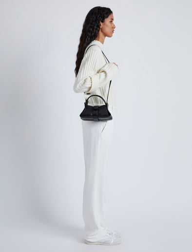 Image of model wearing Mini Park Crossbody Bag in BLACK