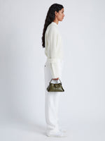 Image of model wearing Mini Park Crossbody Bag in OLIVE