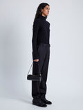 Image of model wearing Silo Bag in Ostrich Embossed Calf in BLACK