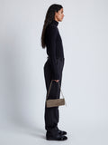 Image of model wearing Silo Bag in Kid Suede in TAUPE