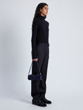 Image of model wearing Silo Bag in Kid Suede in DEEP NAVY