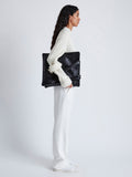 Image of model carrying Split Tote in Nappa in Black