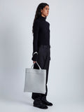 Image of model wearing Split Tote in Nappa in Light Grey