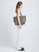 Image of model wearing Days Tote in Pebbled Calf Skin in SLATE