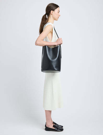 Proenza Schouler image of model wearing Brant Bucket Bag in Smooth Calf in black