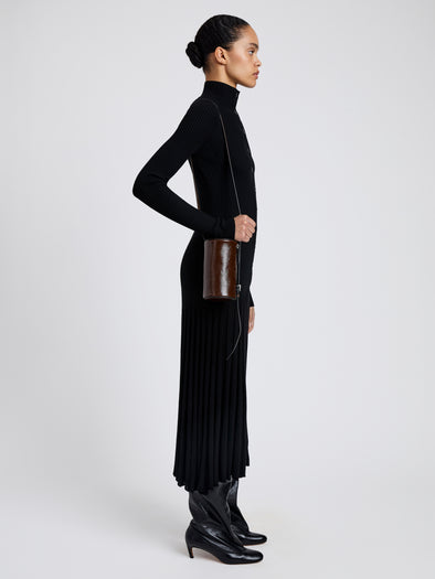 Proenza Schouler image of model wearing Crossbody Silo Bag in Shiny Calf in cedar