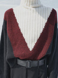 Cropped image of model wearing Alma Sweater in Graphic Instrasia in red multi