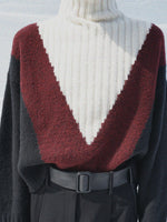 Cropped image of model wearing Alma Sweater in Graphic Instrasia in red multi